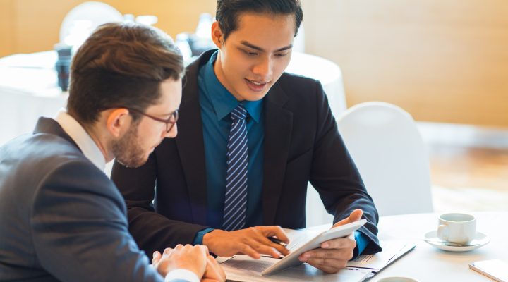 two content business partners discussing issue